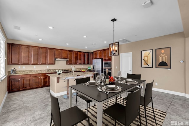 dining area featuring light tile patterned floors