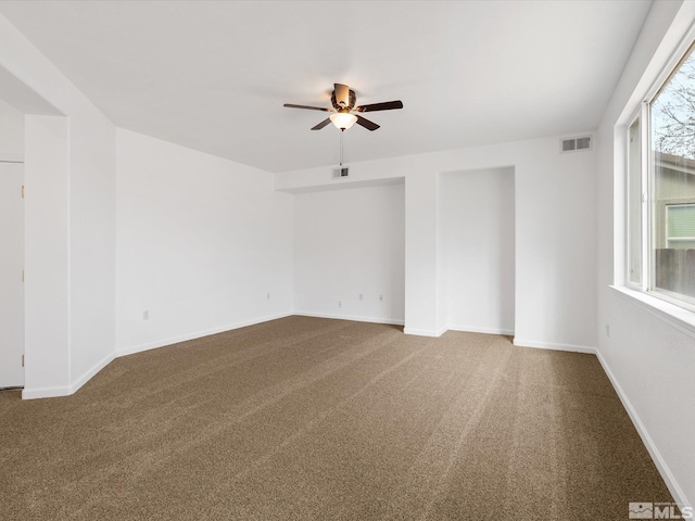 empty room featuring ceiling fan and carpet flooring