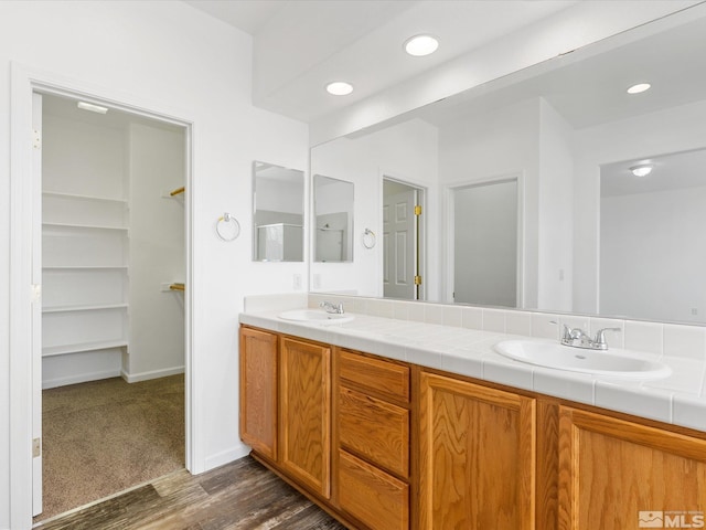 bathroom featuring hardwood / wood-style flooring and vanity