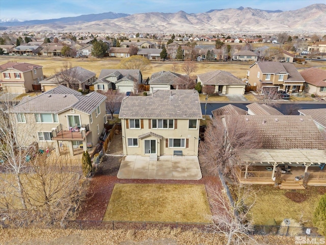 birds eye view of property with a mountain view