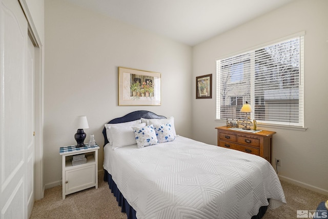 carpeted bedroom with a closet