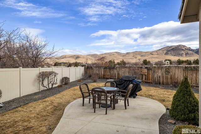 view of patio / terrace with a mountain view