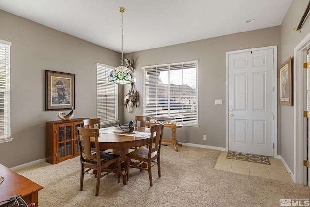 view of carpeted dining area