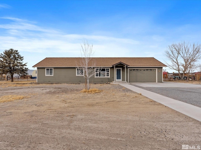 ranch-style house featuring a garage