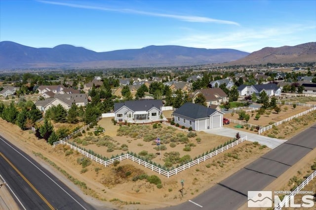 birds eye view of property featuring a mountain view