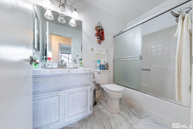 full bathroom with vanity, toilet, and combined bath / shower with glass door