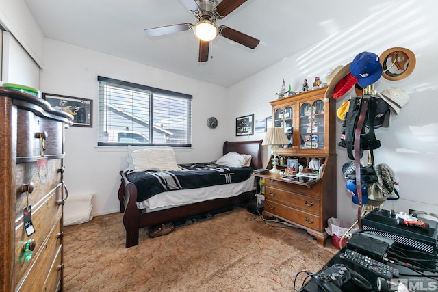 bedroom featuring ceiling fan and carpet flooring