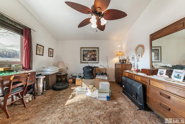 interior space with ceiling fan