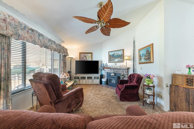 living room featuring vaulted ceiling, light colored carpet, and ceiling fan