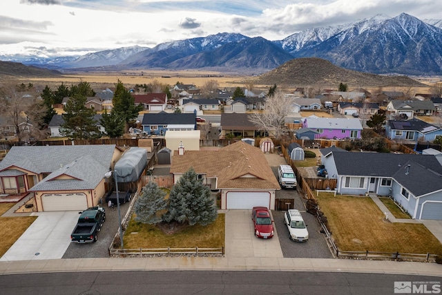 birds eye view of property featuring a mountain view