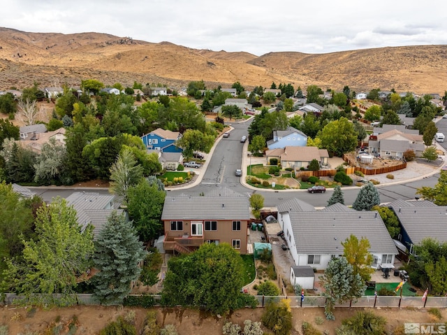 birds eye view of property featuring a mountain view