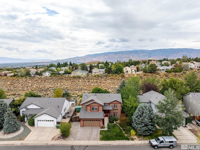 birds eye view of property featuring a mountain view