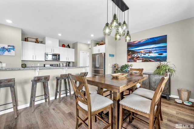 dining room with light hardwood / wood-style floors