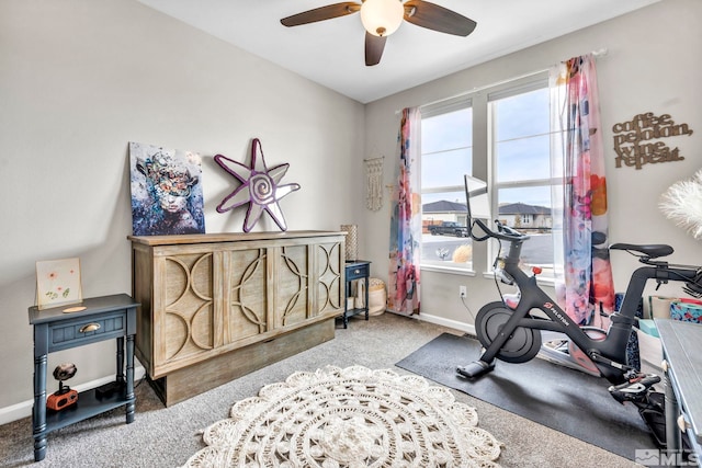 exercise area with carpet floors and ceiling fan