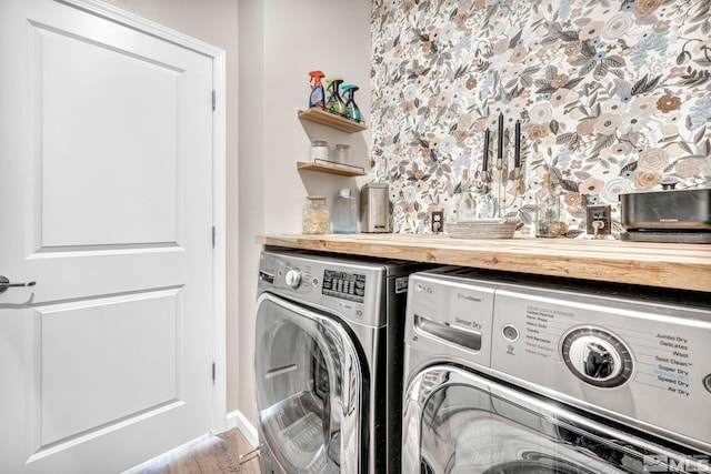 washroom featuring washer and dryer and bar area