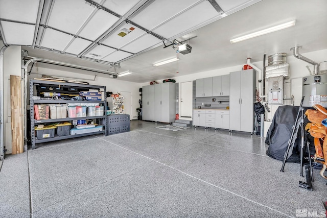 garage with a garage door opener and water heater