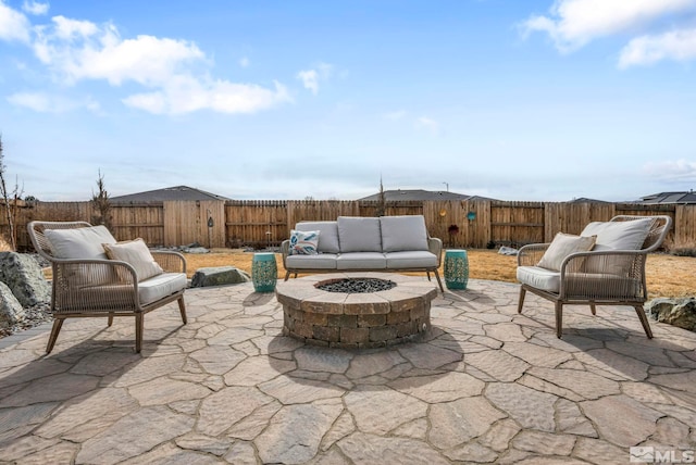 view of patio / terrace with an outdoor living space with a fire pit