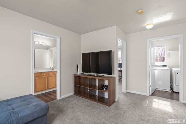 carpeted living room featuring separate washer and dryer