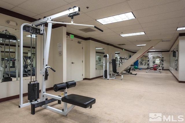 workout area featuring a paneled ceiling