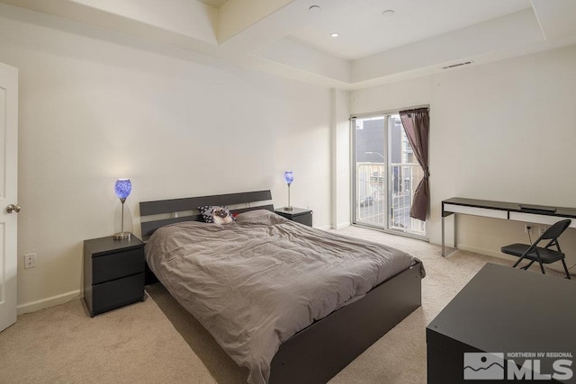 bedroom featuring light colored carpet and access to exterior