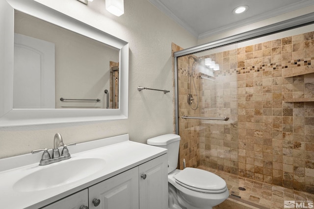 bathroom featuring vanity, crown molding, toilet, and walk in shower