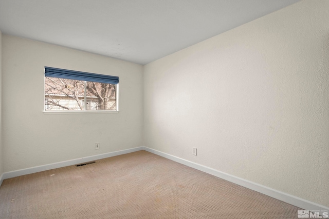 empty room featuring carpet floors