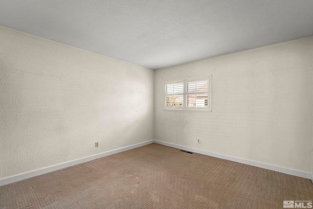 empty room with carpet flooring