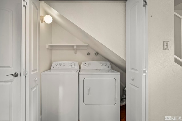 laundry room with washer and clothes dryer