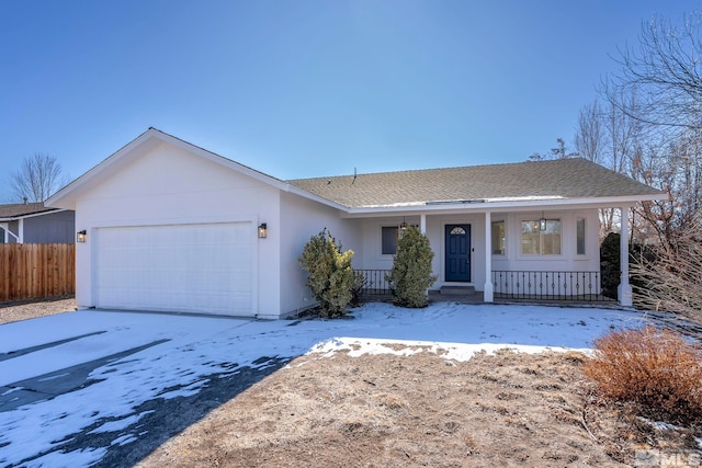 single story home with a garage and covered porch