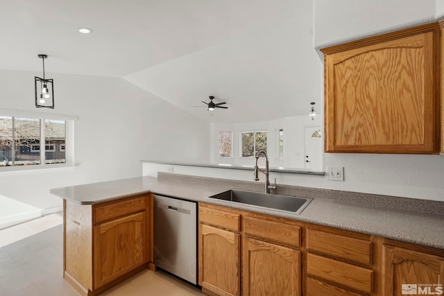 kitchen with dishwasher, sink, kitchen peninsula, and a wealth of natural light