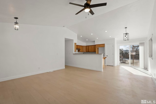 unfurnished living room with ceiling fan, lofted ceiling, and light hardwood / wood-style flooring