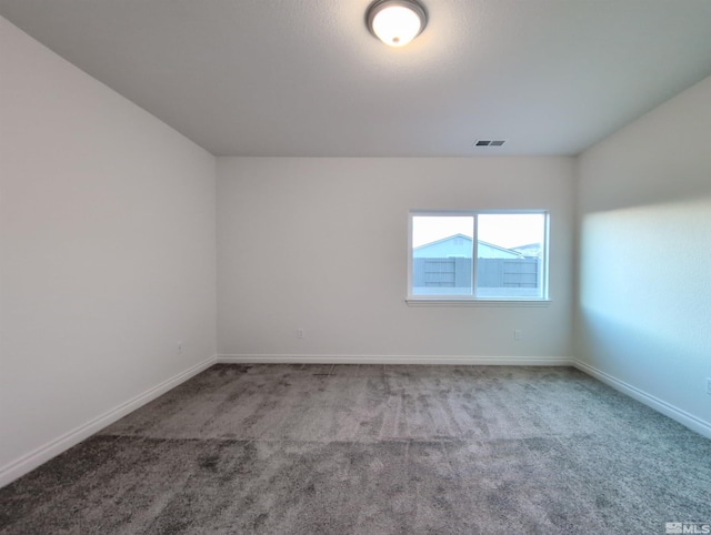 unfurnished room featuring carpet floors