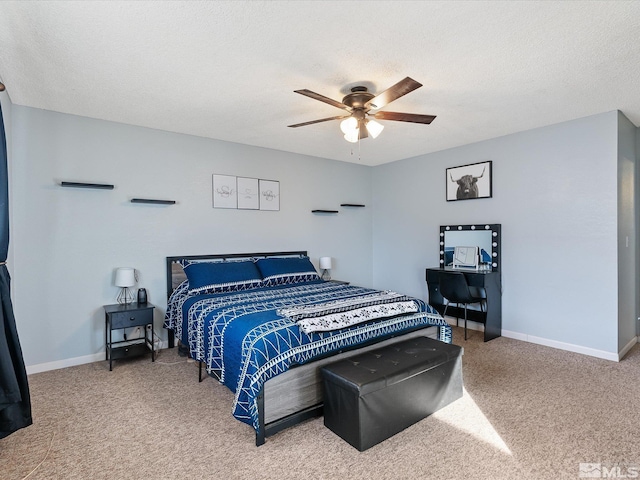 carpeted bedroom with ceiling fan and a textured ceiling