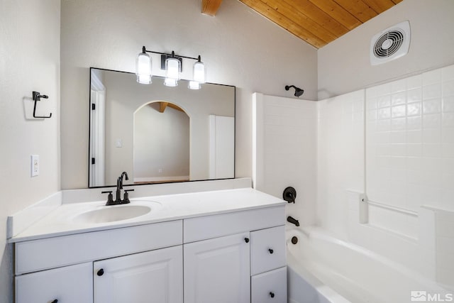 bathroom featuring vanity, wooden ceiling, bathing tub / shower combination, and lofted ceiling