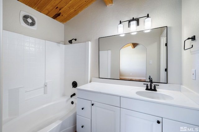 bathroom featuring vanity, bathtub / shower combination, vaulted ceiling, and wooden ceiling