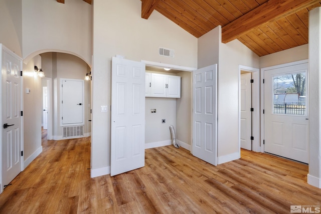 laundry area with light hardwood / wood-style flooring, wooden ceiling, a towering ceiling, washer hookup, and hookup for an electric dryer