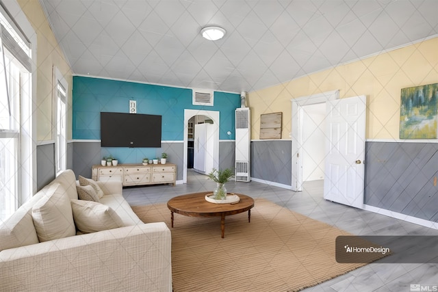 living room with tile patterned flooring and tile walls