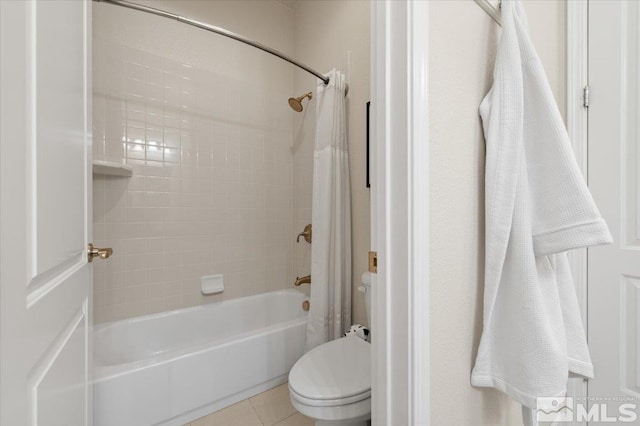 bathroom featuring shower / bathtub combination with curtain, toilet, and tile patterned flooring