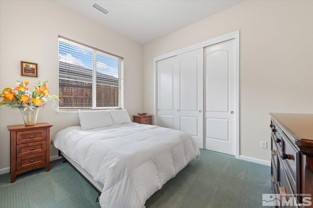 carpeted bedroom featuring a closet