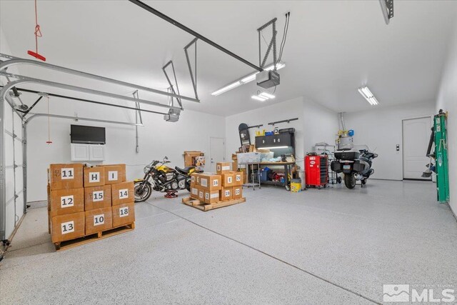 garage featuring a garage door opener