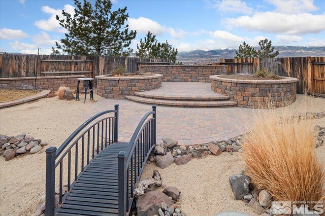 view of patio / terrace with a mountain view