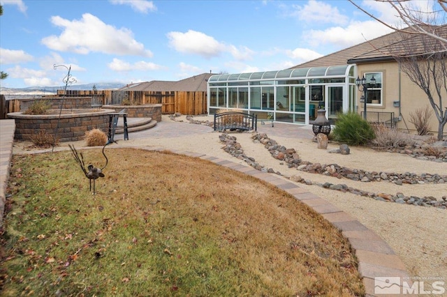 view of yard with a patio area and a sunroom