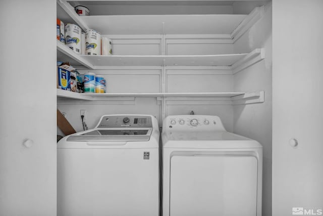 laundry room with washer and dryer