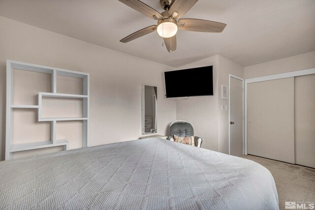 unfurnished bedroom featuring light colored carpet, ceiling fan, and a closet