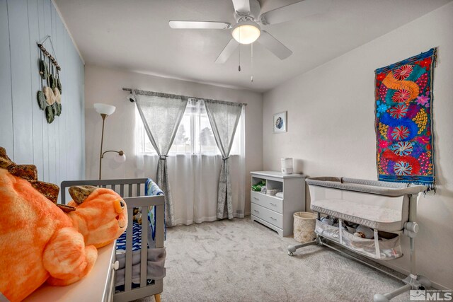 interior space featuring ceiling fan and light colored carpet