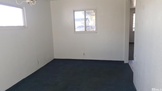 unfurnished room featuring plenty of natural light