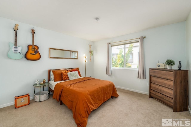 bedroom with light carpet