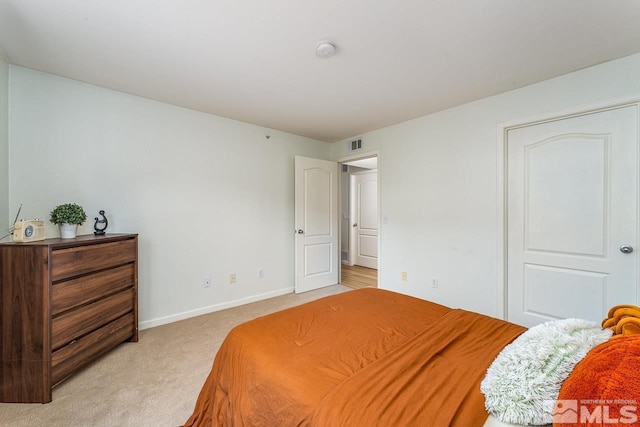 bedroom with light carpet