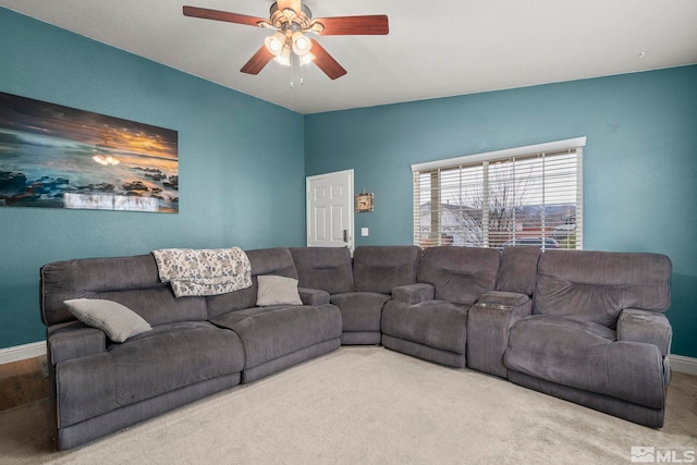 living room with carpet flooring and ceiling fan