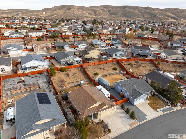 birds eye view of property with a mountain view